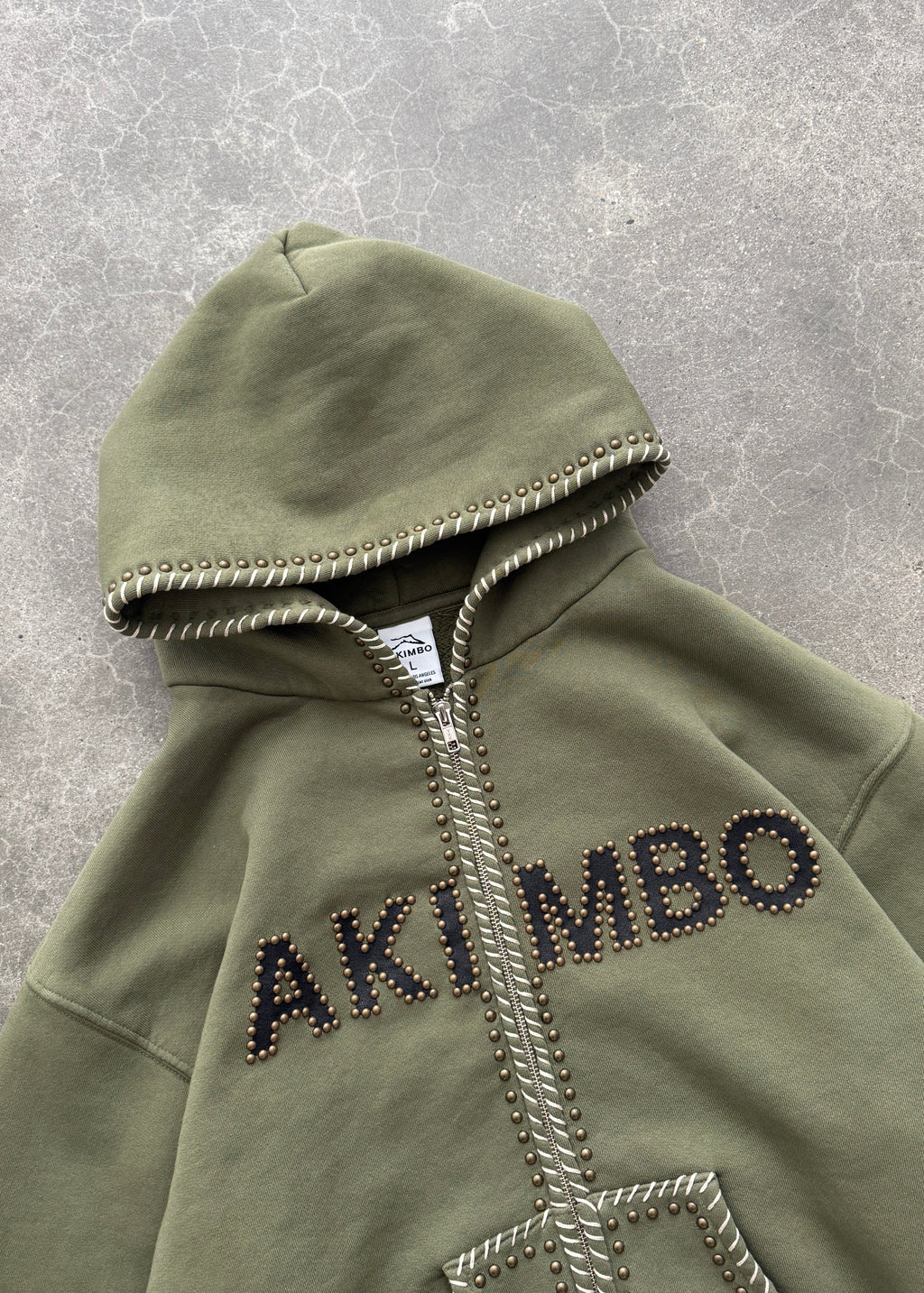 STUDDED TRAINING ZIP-UP HOODIE - OD GREEN