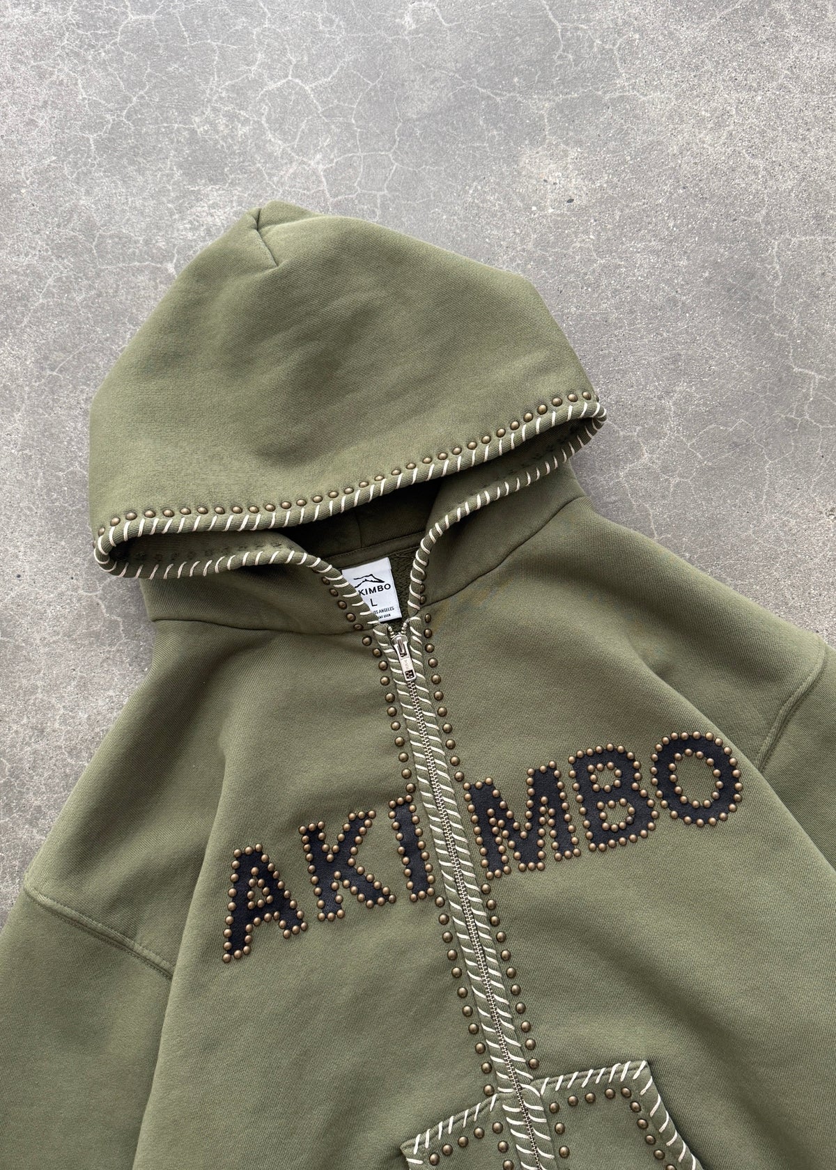 STUDDED TRAINING ZIP-UP HOODIE - OD GREEN