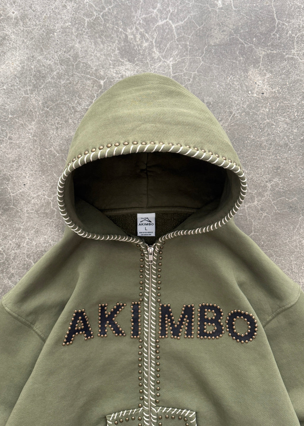 STUDDED TRAINING ZIP-UP HOODIE - OD GREEN