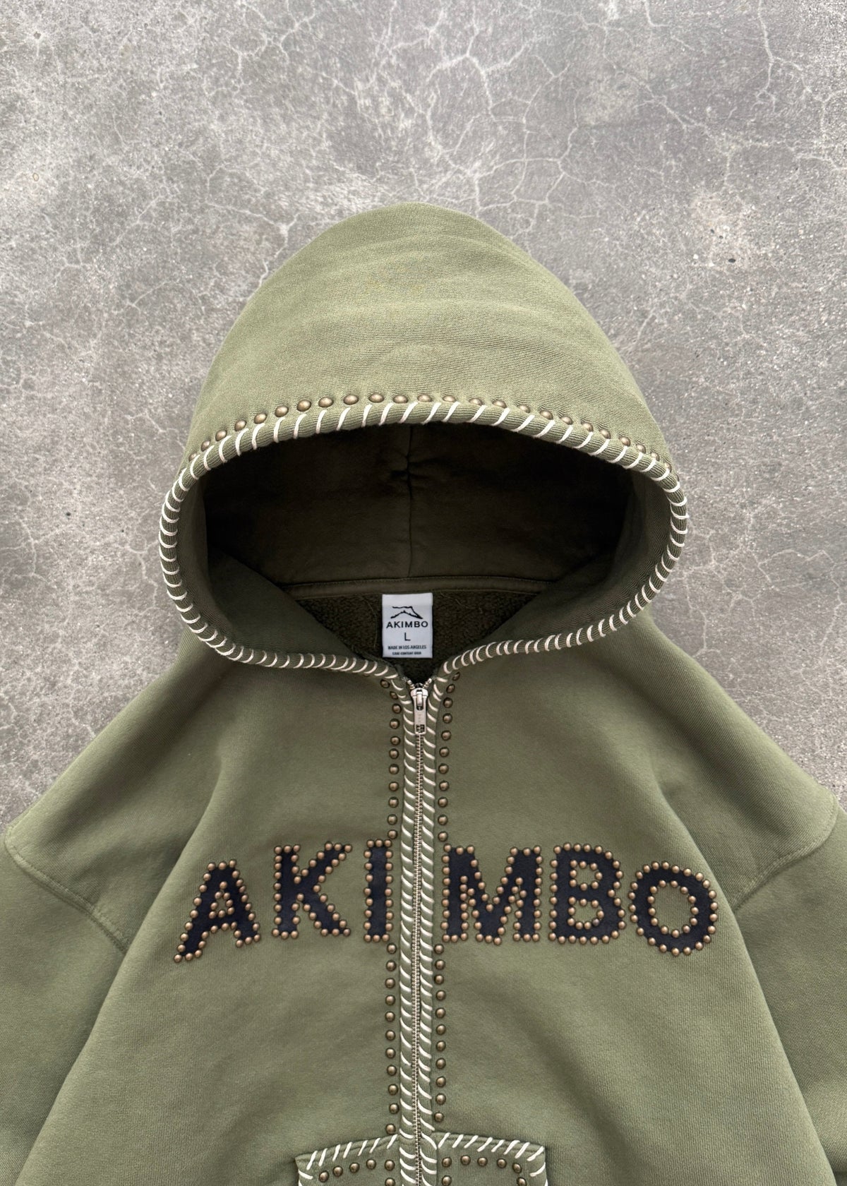 STUDDED TRAINING ZIP-UP HOODIE - OD GREEN