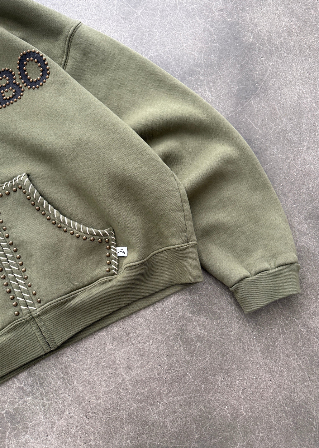 STUDDED TRAINING ZIP-UP HOODIE - OD GREEN