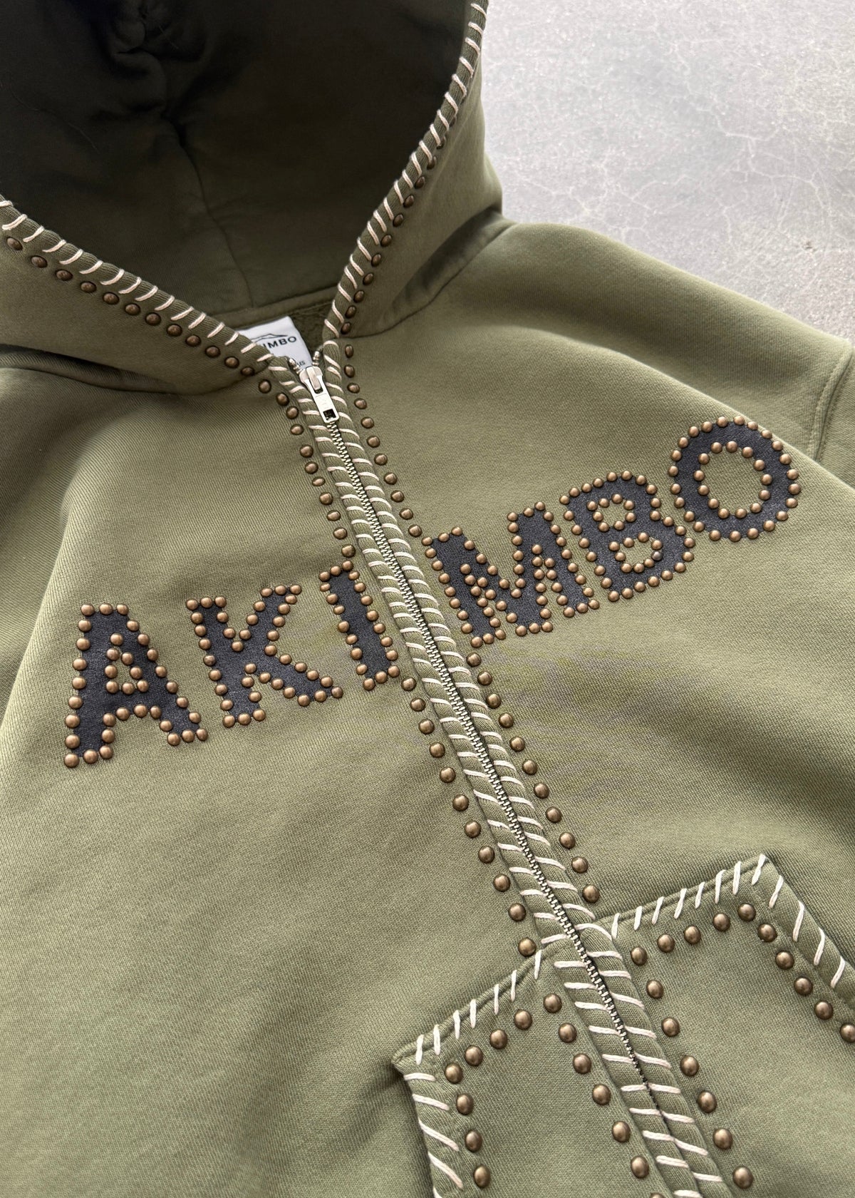 STUDDED TRAINING ZIP-UP HOODIE - OD GREEN